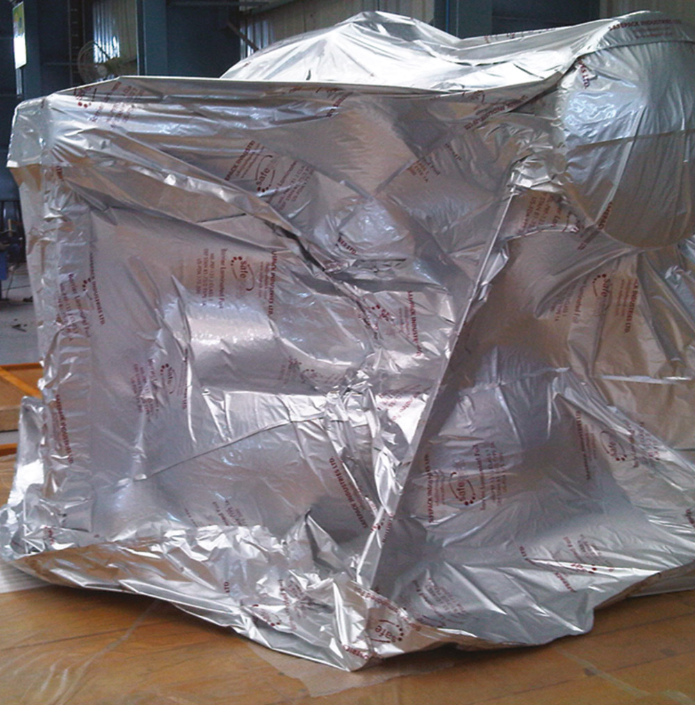 Silver vacuum barrier packaging around industrial equipment